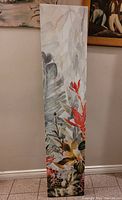 Side view of a single floral painted panel with red flowers and leaves on a light background.