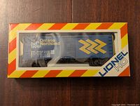 Front view of Lionel HO scale Ontario Northland boxcar T-20101 in original box with clear window showing model details.