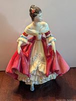 Front view of the Royal Doulton porcelain figurine showing detailed dress and facial features.