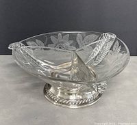 Side angled view showing the floral etched glass divided bowl with sterling silver base.