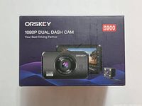 Front of the box showing ORSKEY branding, model S900, and product image of the dual dash cam with front and rear camera units and 3-inch LCD screen.