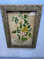 Full view of the vintage wall picture frame showing detailed ornate gold frame and floral embroidery artwork.