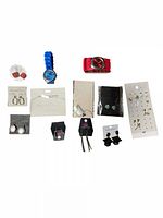 All 12 jewelry items laid out in a single photo showing different earrings, two wristwatches, bracelets, and display cards.