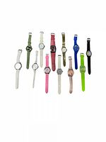 Collection of 13 assorted wristwatches arranged on a white background, showing different colors and styles of bands and faces.
