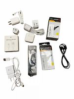 Photo showing all cables, USB wall chargers, USB adapter plugs, and boxed AUX headphones