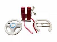Two Nintendo Wii remotes in charging dock with power cord and two white plastic steering wheel controllers, plus nunchuck cables attached to remotes.