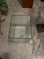 Top-down view of the glass cube table showing its hollow interior and clear glass construction.