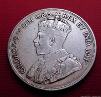Obverse side of 1936 Canada silver dollar featuring King George V portrait and inscription