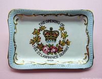 Top view of a rectangular pin dish with blue border, gold trim and floral crown design for the St. Lawrence Seaway opening in 1959.