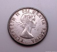Obverse side of the 1962 Canadian 50 cent coin showing Queen Elizabeth II profile and inscription.