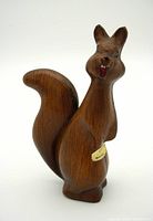 Front view of the Expo 67 squirrel figurine showing painted wood grain texture and rhinestone eyes.