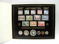 Front view of open set showing 12 Canada Centennial postage stamps in two rows and 6 coins below on black display panel.