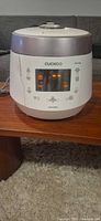 Front view of Cuckoo CPR P1009s rice cooker showing control panel and display