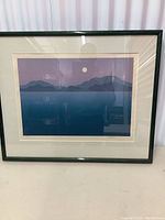 Front view of framed limited edition print showing mountain silhouettes, full moon, and gradient colored sky in minimalist style.