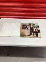Two Pink Floyd record jackets on a table, showing front covers of The Wall and Wish You Were Here albums