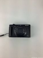 Front view of Sony Cyber-shot camera showing lens closed and branding