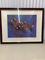 Full view of the framed vintage signed and numbered art print showing a colorful abstract depiction of an orchestra on purple background.