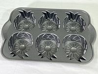 Top view of the entire cake pan showing all six pineapple-shaped molds.