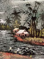 Close-up showing detail of two figures by water, houses, palm trees, and foliage on black lacquered wood with speckled moonlit sky.