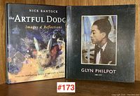 Front cover image showing covers of both books, one titled 'Glyn Philpot 1884-1937' with a portrait and the other 'The Artful Dodger' with mixed media artwork