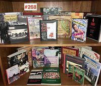 Group shot of 31 used books arranged on two shelves