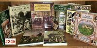 Full lot of 9 books photographed together showing covers and titles related to British country houses and Victorian interiors.