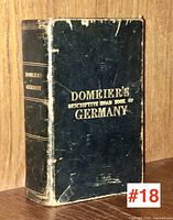 Front cover of black hardcover with gold embossed lettering reading 'Domeier's Descriptive Road Book of Germany'. Shows wear and scuffing on cover edges.