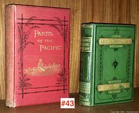 Two antique books side by side on wooden shelf: "Parts of the Pacific" in red cover and "About Travelling" in green cover with decorative embossing. Photo for visual lot overview.