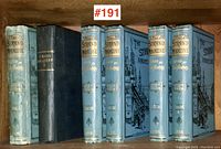 Six volumes on shelf, showing binding and spines