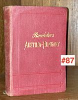 Front cover of the Baedeker travel guide for Austria-Hungary showing red embossed cloth and gilt title.