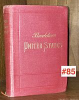 Front cover of Baedeker's United States travel guide showing red textured cover with gold stamped text.