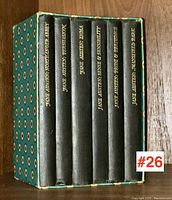 Six hardcover Jane Austen books in a matching decorative slipcase, arranged upright showing spines with gold embossed titles.