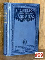 Front cover of The Nelson Universal Hand-Atlas showing blue hardcover with black borders and gold lettering on spine