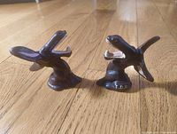 Both cast iron donkey bottle openers front view