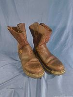 Front view of both boots showing overall design and condition
