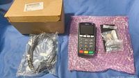 Entire lot showing iPP350 terminal, sealed cable, accessory kit, and box