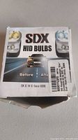 Front of SDX HID Bulbs box showing model H4 Bi-Xenon 35W 6000K