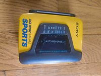 Front view showing Sony Sports branding, tuner scale, model info