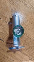 Full view of Western Medica oxygen regulator showing body, gauge, T-handle, outlet