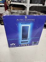 Box of Altec Lansing stereo speaker system, blue with branding and model information