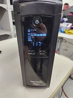 Front view showing power button, LED display indicating load capacity, battery capacity and input voltage.