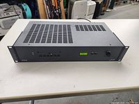 Full front and top view of Extron MLS 506 MediaLink Switcher on white table showing ventilation and button layout.