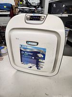 Front view of Idylis white air purifier with brand and features sticker