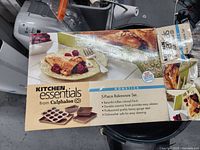 Original box of Kitchen Essentials 5-piece bakeware set with branding and product details.