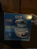 Front view of the ReliOn Cool Mist Humidifier box showing product image and features.