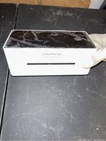 Front-facing closed view of LabelRange LP620 label printer showing the white body and black top surface with branding.