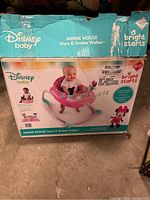Full view of original box showing Disney Baby Minnie Mouse Stars & Smiles Walker with branding and baby image on front.