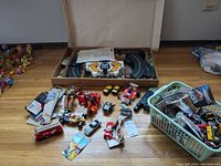 Overview of slot car track pieces, transformers, and accessories