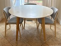 Front view of entire table with background chairs