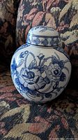 Front and side views of the blue and white floral porcelain jar with lid